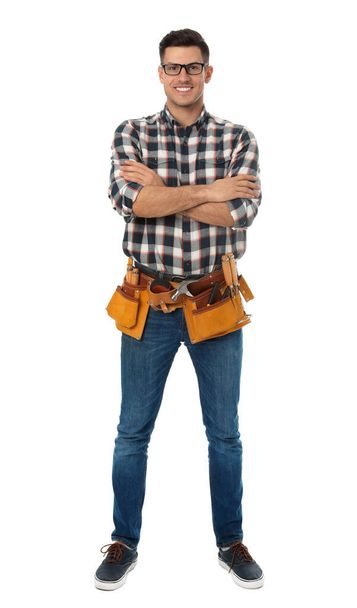 Handsome carpenter with tool belt isolated on white - Фото, зображення
