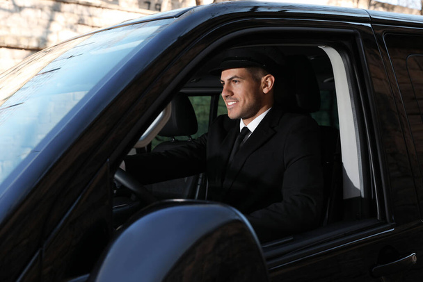 Professional driver in luxury car. Chauffeur service - Foto, Bild