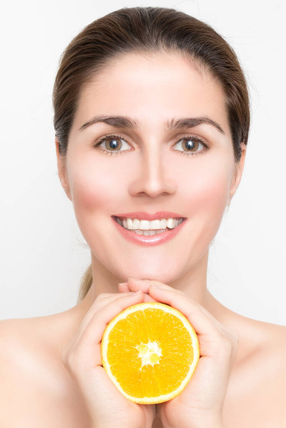 Beautiful girl with juicy grapefruit and orange fruit - Photo, Image