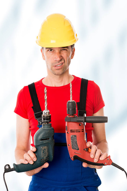 wild man with helmet and two drilling machine - Photo, image