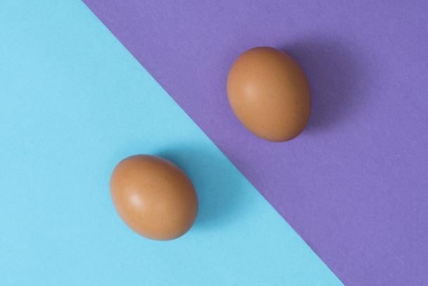 two eggs on a two-color surface - Fotó, kép