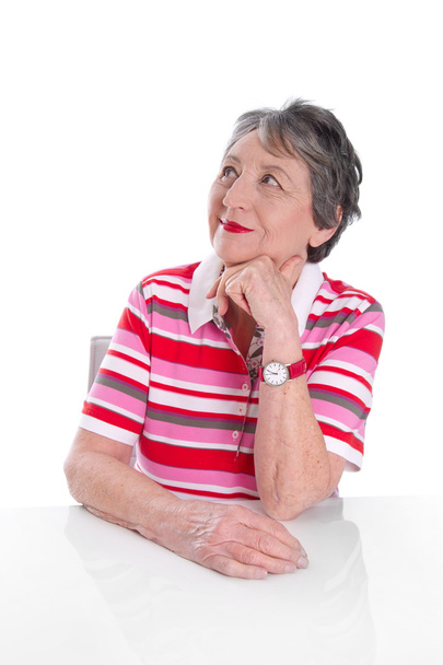 Pensive elderly lady smiles - Foto, imagen