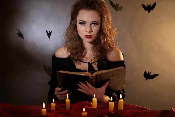 Halloween witch on dark background - Photo, Image