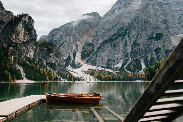 Stunning romantic place with typical wooden boats on the alpine lake, Lago di Braies - Foto, Bild