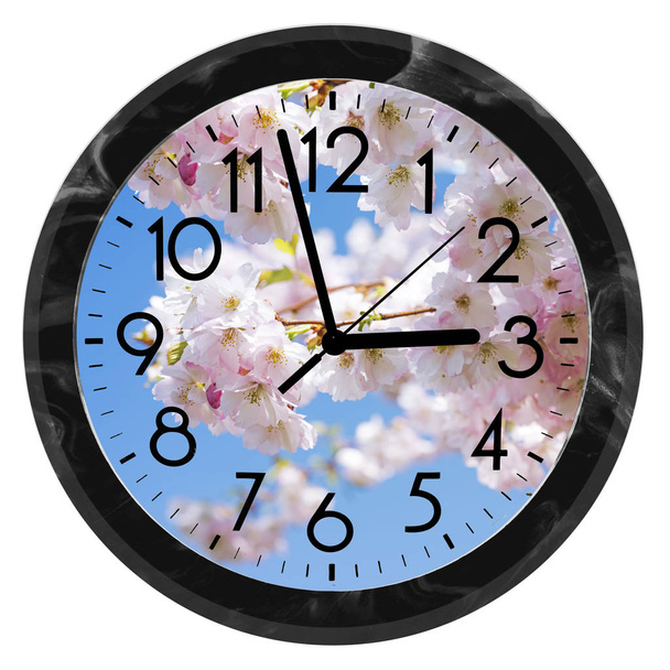 Daylight Saving Time. DST. Wall Clock going to winter time. Turn time forward. Abstract photo of changing time at spring. - Zdjęcie, obraz