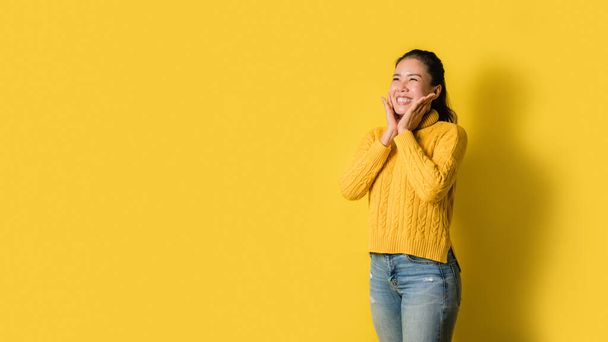 Image of beautiful cute young girls smiling and happy isolated over yellow background. - 写真・画像