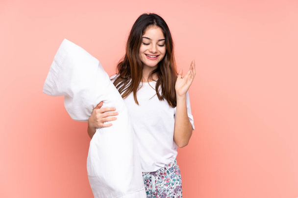 Young woman in pajamas isolated on pink background laughing - Photo, Image