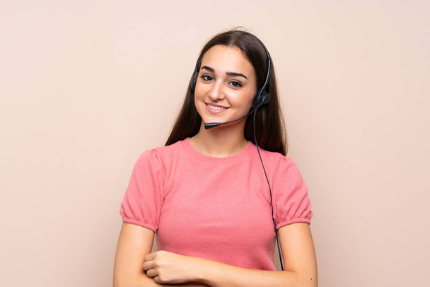 Young woman over isolated background working with headset - Photo, image