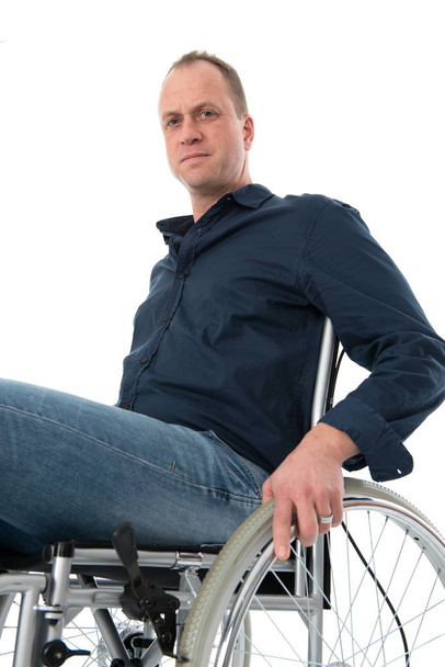 disabled man sitting on chair - Фото, изображение