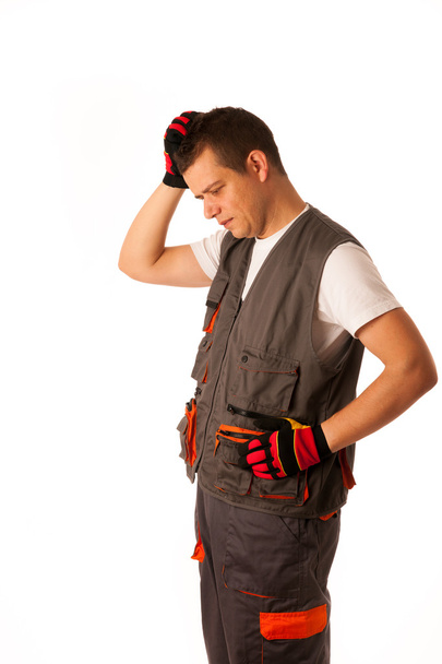 Worried construction worker isolated over white background - Foto, immagini
