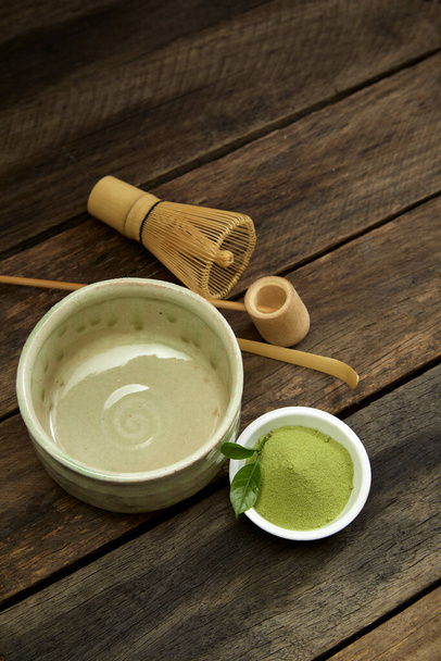Organic Green Matcha Tea in a Bowl - Фото, изображение