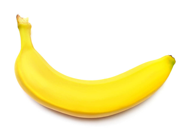 Single banana against white background. Flat lay, top view - Fotografie, Obrázek