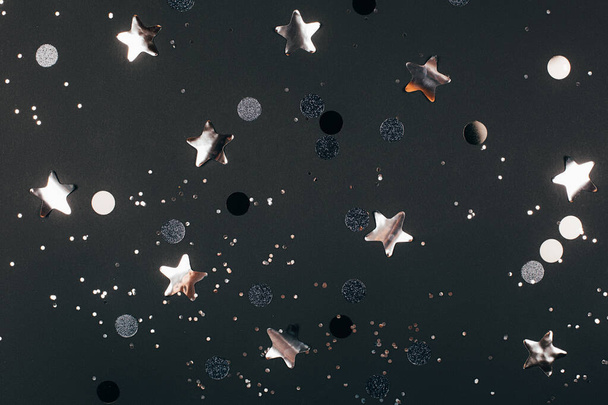 Black background with silver sparkles and stars - Valokuva, kuva
