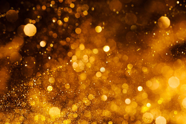 Splash of golden sparkles - Photo, image