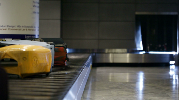 Baggage conveyor belt in the airport carrying the passenger luggage - Footage, Video