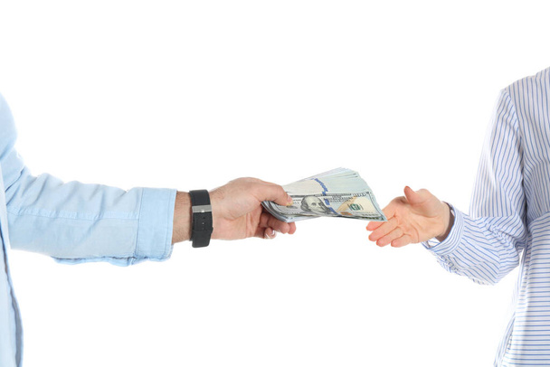Man giving bribe money to woman on white background, closeup of  - Valokuva, kuva