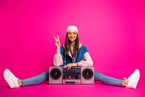 Portrait of her she nice attractive lovely cheerful cheery glad girl sitting next to boom-box showing v-sign twine isolated on bright vivid shine vibrant pink fuchsia color background - Фото, изображение