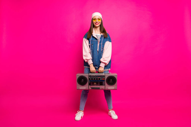 Full length body size view of her she nice attractive pretty cool cheerful cheery girl carrying boom-box having fun holiday isolated on bright vivid shine vibrant pink fuchsia color background - Fotoğraf, Görsel
