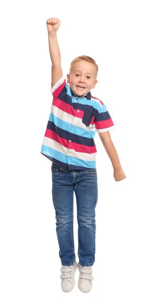 Cute little boy jumping on white background - Φωτογραφία, εικόνα