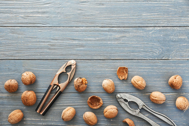 Tasty walnuts and crackers on table - Photo, image