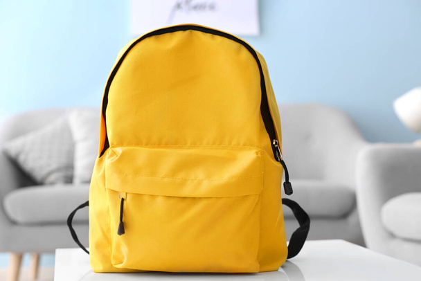 School backpack on table in room - Photo, Image