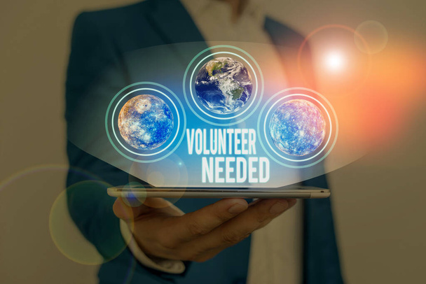 Text sign showing Volunteer Needed. Business photo text need work or help for organization without being paid Elements of this image furnished by NASA - Photo, Image