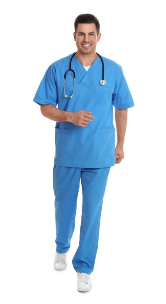 Doctor in uniform walking on white background - Photo, Image