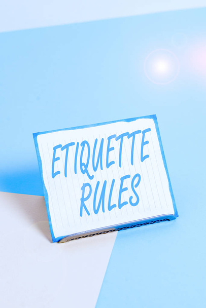 Conceptual hand writing showing Etiquette Rules. Concept meaning customs that control accepted behaviour in social groups Paper on buffer wire on soft pastel multi colours backdrop - Fotoğraf, Görsel