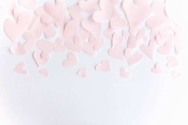 Cute pink pastel hearts border on white paper  background with c - Fotó, kép