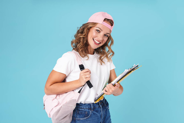 Cheerful cute girl student carrying backpack - Zdjęcie, obraz