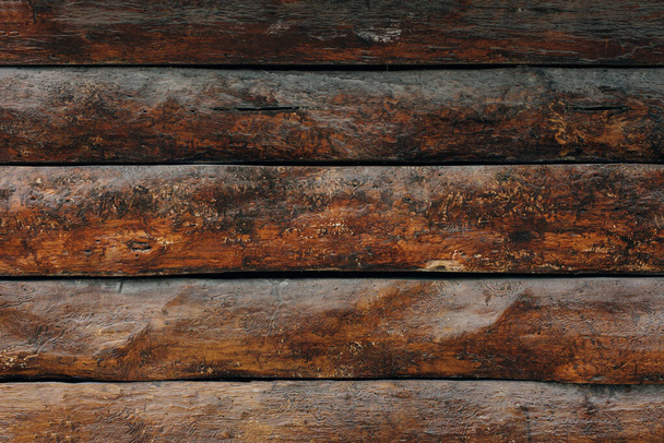 Dark wooden fence. Shabby table, dirty pine lumber. Old wood boards. - Fotó, kép