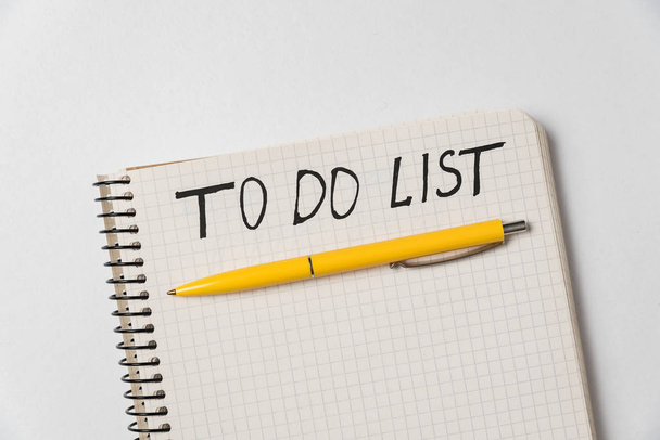 To do list. Notebook and colorful pen on white background. Handwritten, Top view - Foto, Bild