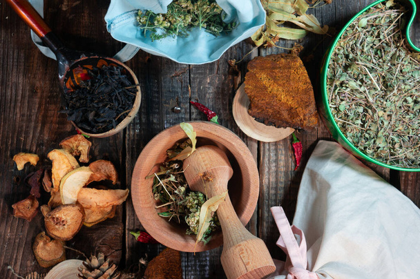 wooden spoon with ivan tea table of herbalist and healer healing herbs, alternative medicine, set of a medicine man, - Fotoğraf, Görsel