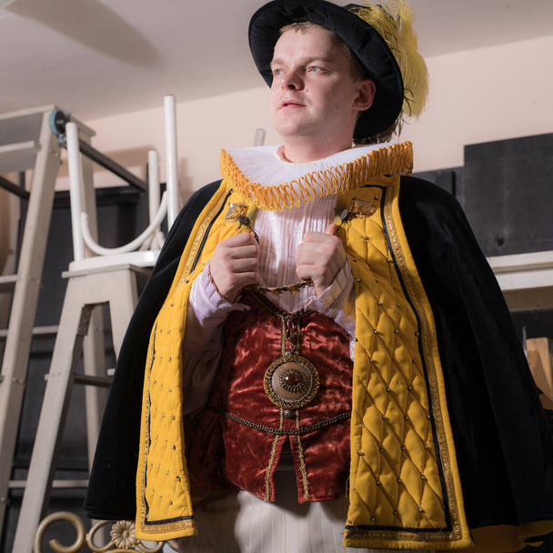 Actor dressed historical costume in interior of old theater. - Φωτογραφία, εικόνα