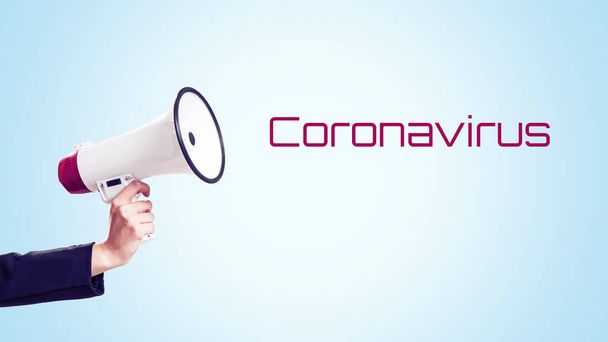 Panika pro koronavirus. Osoba držící megafon - Fotografie, Obrázek