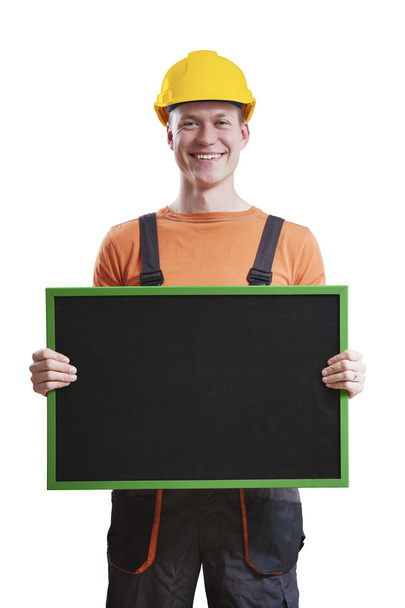 Trabalhador da construção segurando quadro-negro
 - Foto, Imagem