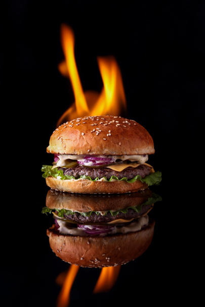 burger with fire on a black background for the site8 - Photo, Image