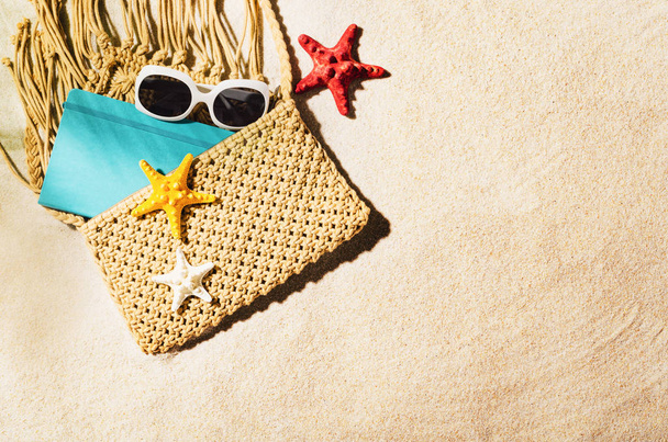 Background with sandy beach, top view. Summer accessories concept - 写真・画像