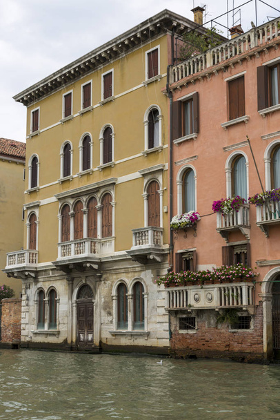 Venice, Italy - August 22, 2019: Architecture and facade of the old city buildings of Venice - Photo, Image
