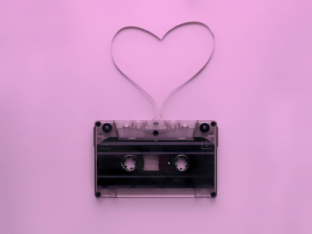 audio cassette with magnetic tape in shape of heart - Foto, Bild