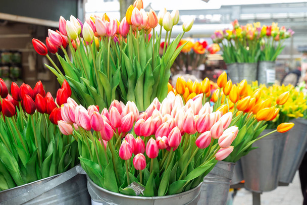 Bunches of beautiful tulip flowers for sale in a flower market. Colorful tulips. Florist service. Woman day - Φωτογραφία, εικόνα