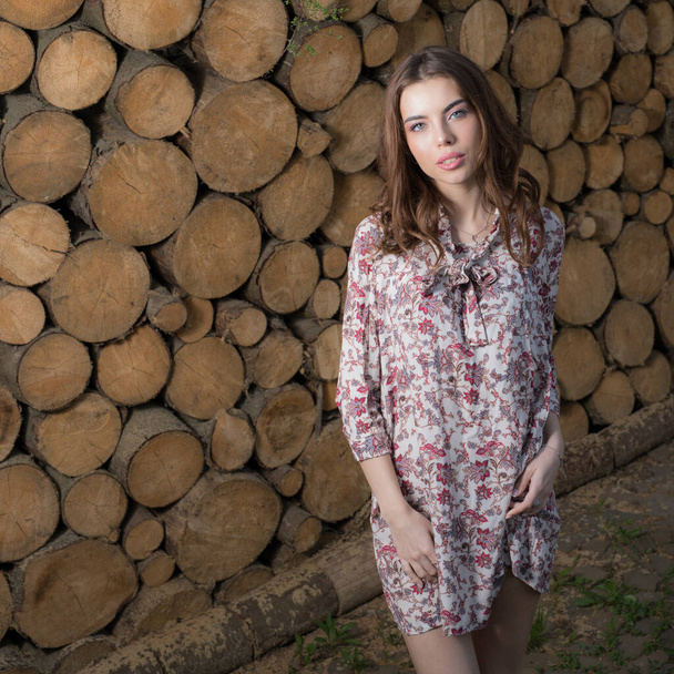 Portrait of beautiful young girl on wooden background. - Valokuva, kuva