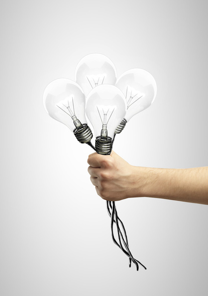 hand holding light bulb - Foto, imagen