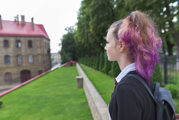 Outdoor teenager girl student with backpack in school uniform - Foto, Imagem