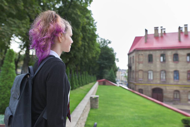 Outdoor teenager girl student with backpack in school uniform - Foto, Imagem