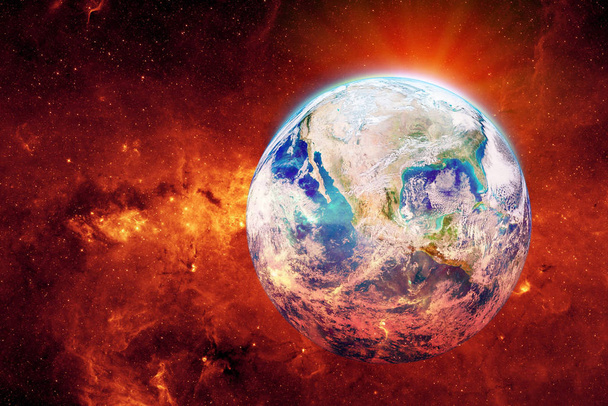 Глобальное потепление и поляризация: потепление на голубой планете и красный огонь, растущий вокруг Земли. (Elements of this image furnished by NASA
.) - Фото, изображение
