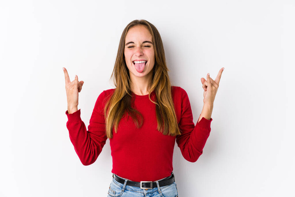 Young caucasian woman posing isolated  showing rock gesture with fingers - Photo, Image