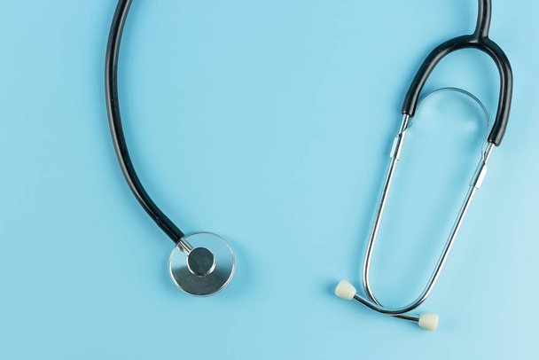 Stethoscope on blue background.  Healthcare and Health Insurance - Valokuva, kuva