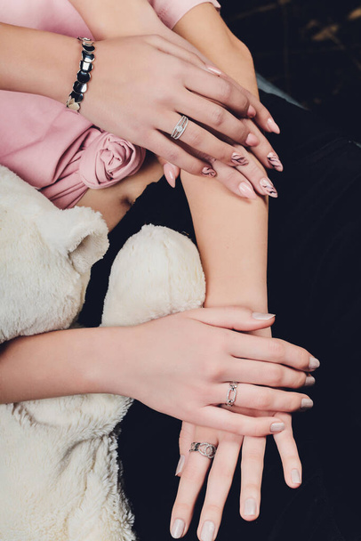 Close up of hands of woman showing the ring with diamond. She is engaged. - 写真・画像