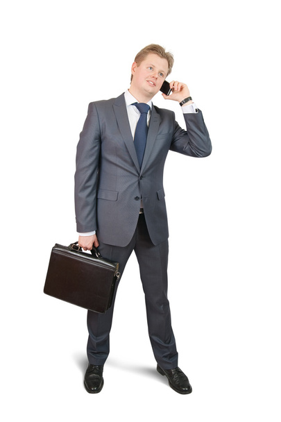 Businessman speaking by mobile over white - Photo, Image